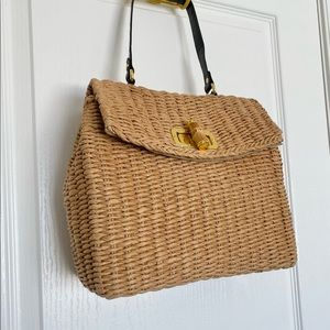 Woven straw handbag with bamboo detail clasp